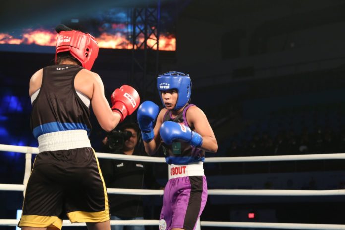 NE Rhinos' Meenakshi (R) in action against Punjab Panthers' Darshana Doot during Semi Final 2 of the Big Bout Indian Boxing League
